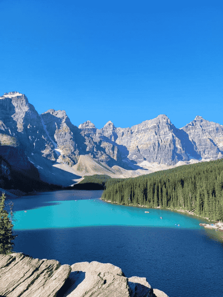 Turquoise Moraine Lake surrounded by mountain peaks in Banff National Park, Canadian Rockies