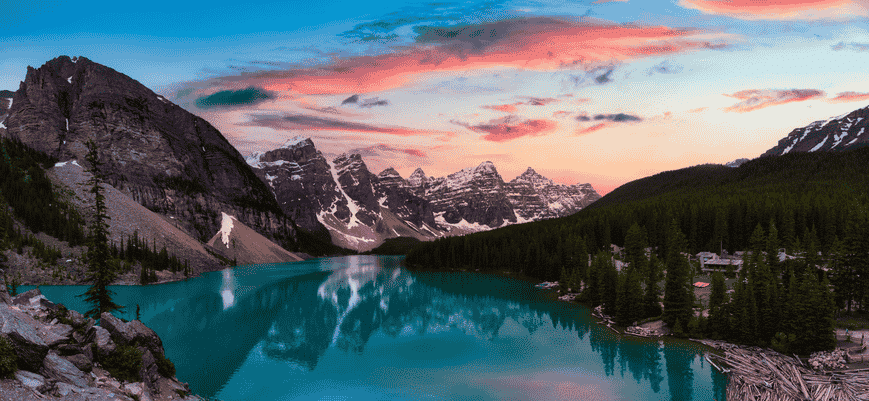 Sunset over Moraine Lake with turquoise water and mountain reflections in Banff National Park, Canadian Rockies