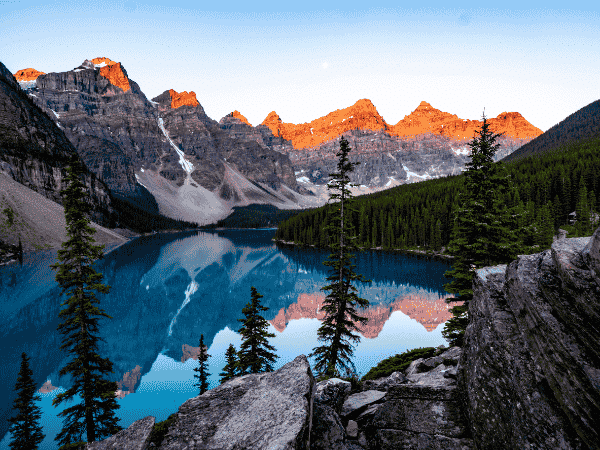Scenic view of Moraine Lake with mountain reflections in Banff National Park, Canadian Rockies