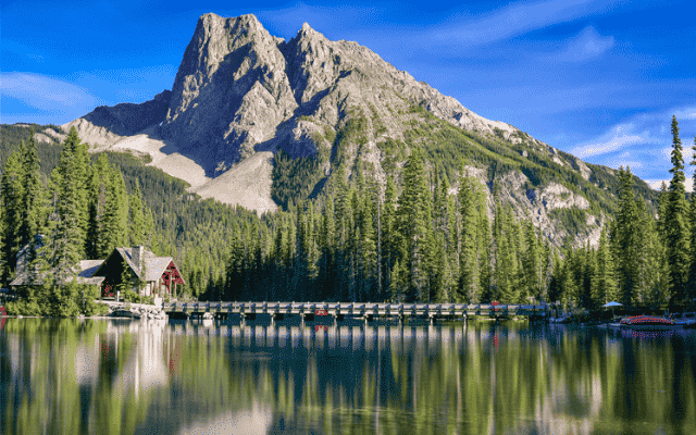 Emerald Lake Lodge reflected in calm waters at Emerald Lake, Yoho National Park, British Columbia