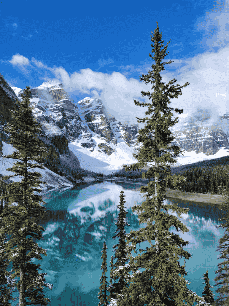 Moraine Lake with turquoise water and snowy mountain reflections in Banff National Park, Canadian Rockies