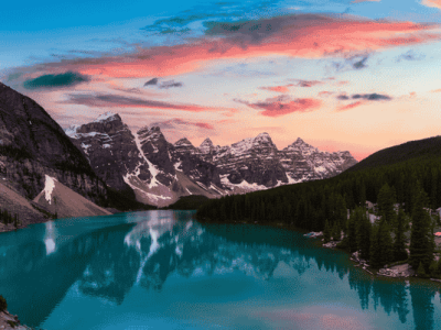 Sunset over Moraine Lake with turquoise water and mountain reflections in Banff National Park, Canadian Rockies