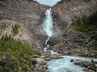 Close-up of Takakkaw Falls flowing into a glacial river in Yoho National Park, British Columbia