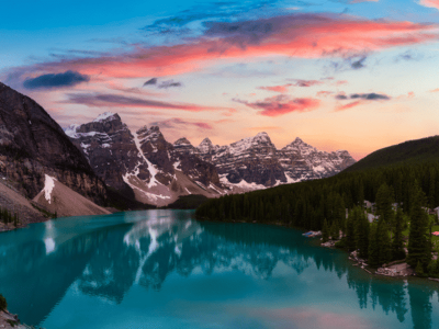 Sunset over Moraine Lake with turquoise water and mountain reflections in Banff National Park, Canadian Rockies
